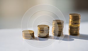 Stack of coins, polish zloty on the gray background