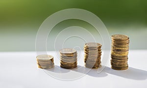 Stack of coins, polish zloty on the green background