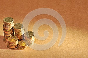 Stack of coins with selected light source with copy space area