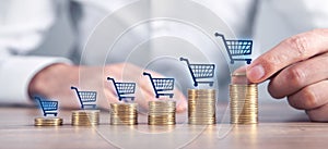 Stack of coins with a shopping carts. Shopping. Business