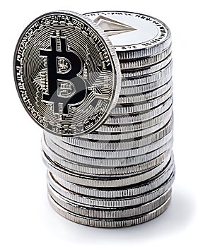 A stack of coins with a silver coin on top that says B