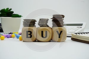 Stack of coins with wood blocks with 