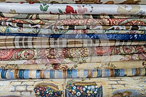 stack of colored fabric with different patterns