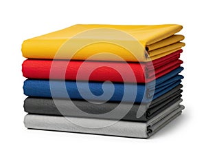Stack of colored fabrics isolated on white background