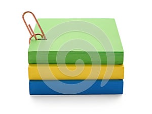 Stack of colored paper blocks isolated on white background