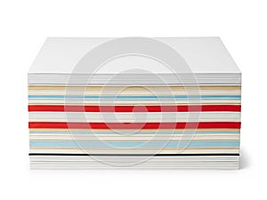 Stack of colored paper sheets isolated on white background