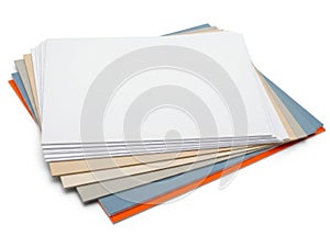 Stack of colored paper sheets isolated on white background