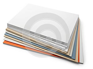 Stack of colored paper sheets isolated on white background