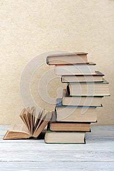 Stack of colorful books. Education background. Back to school. Book, hardback colorful books on wooden table. Education