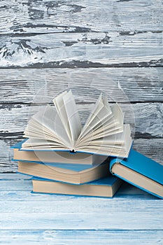 Stack of colorful books. Education background. Back to school. Book, hardback colorful books on wooden table. Education