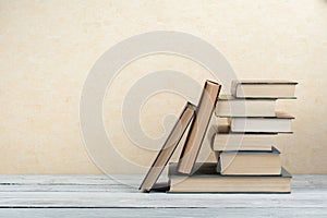 Stack of colorful books. Education background. Back to school. Book, hardback colorful books on wooden table. Education