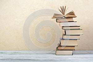 Stack of colorful books. Education background. Back to school. Book, hardback colorful books on wooden table. Education