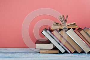 Stack of colorful books. Education background. Back to school. Book, hardback colorful books on wooden table. Education