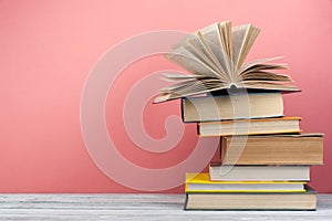 Stack of colorful books. Education background. Back to school. Book, hardback colorful books on wooden table. Education