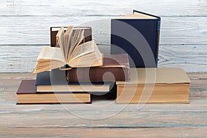 Stack of colorful books. Education background. Back to school. Book, hardback colorful books on wooden table. Education business