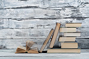 Stack of colorful books. Education background. Back to school. Book, hardback colorful books on wooden table. Education business