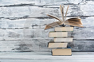 Stack of colorful books. Education background. Back to school. Book, hardback colorful books on wooden table. Education business