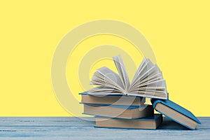 Stack of colorful books. Education background. Back to school. Book, hardback colorful books on wooden table. Education business