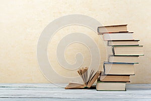 Stack of colorful books. Education background. Back to school. Book, hardback colorful books on wooden table. Education business