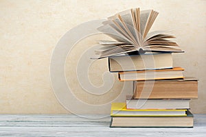 Stack of colorful books. Education background. Back to school. Book, hardback colorful books on wooden table. Education business