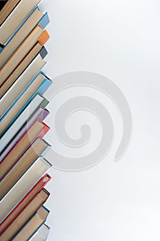 Stack of colorful books. Education background. Back to school. Book, hardback colorful books on wooden table. Education business