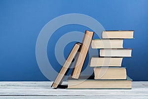 Stack of colorful books. Education background. Back to school. Book, hardback colorful books on wooden table. Education business