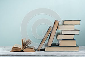 Stack of colorful books. Education background. Back to school. Book, hardback colorful books on wooden table. Education business