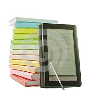 Stack of colorful books and electronic book reader