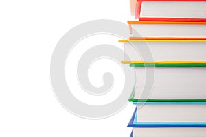 Stack of colorful books isolated on white background. Collection of different books. Hardback books for reading. Back to school an