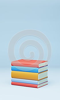 Stack of colorful books on light blue background