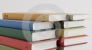 Stack of Colorful Books on a White Surface with Modern Design