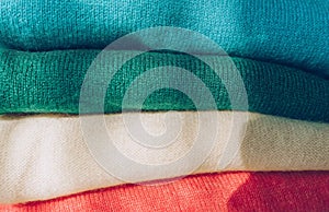 Stack of colorful cachemire clothes