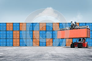 Stack of colorful containers box cargo in port shipping yard with Container handler in loading with floor ground and blue sky