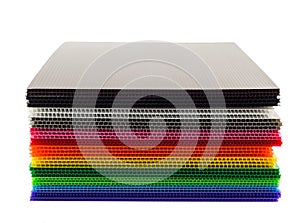 Stack of colorful corrugated plastic sheets