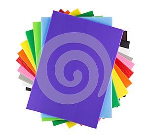 Stack of colorful corrugated plastic sheets