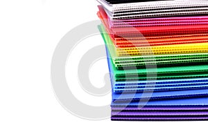 Stack of colorful corrugated plastics isolated on white