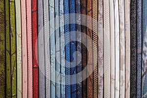 Stack of colorful cotton quilting fabrics as a background image