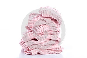 Stack of colorful cozy knitted sweaters