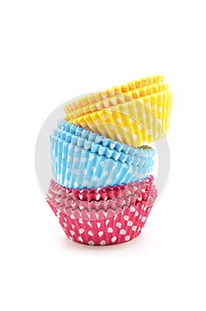 Stack of colorful cupcake cases photo