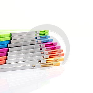 Stack of colorful diskettes isolate on white background