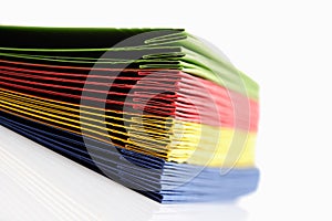 Stack of colorful loose-leaf binders