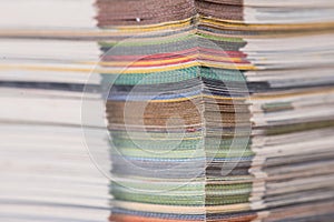 stack of colorful magazines or documents - paper