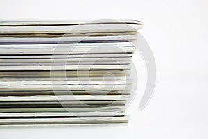 Stack of colorful magazines, vertical