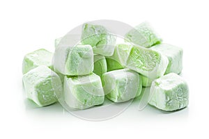 A stack of colorful marshmallows on a clean white surface