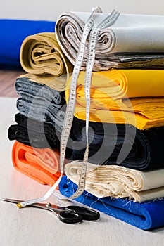 Stack of colorful natural fabrics on the table