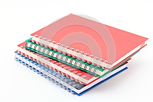 Stack of colorful notebooks.