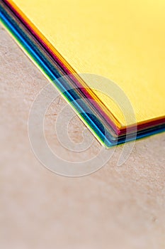 Stack of colorful paper. Blurring background. The corners of sheets of paper close-up. Back to school.