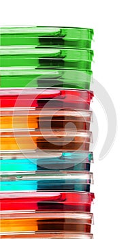 Stack of colorful Petri dishes isolated