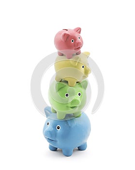 Stack of colorful piggy banks. Energy saving concept.