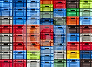 Stack of colorful plastic boxes photo